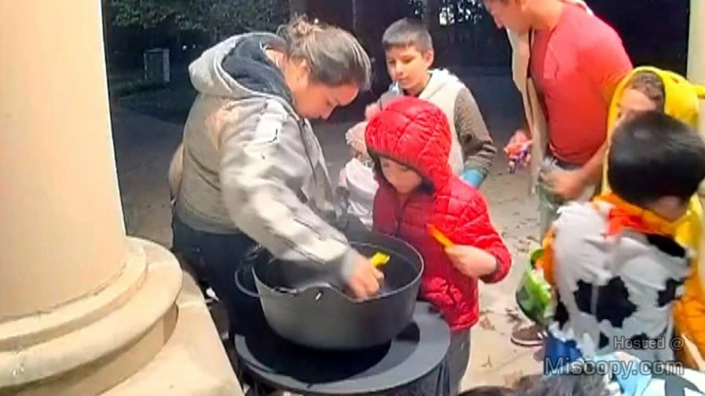 CCTV of Children Accompanied by Mother Raiding Halloween Candy Bowl