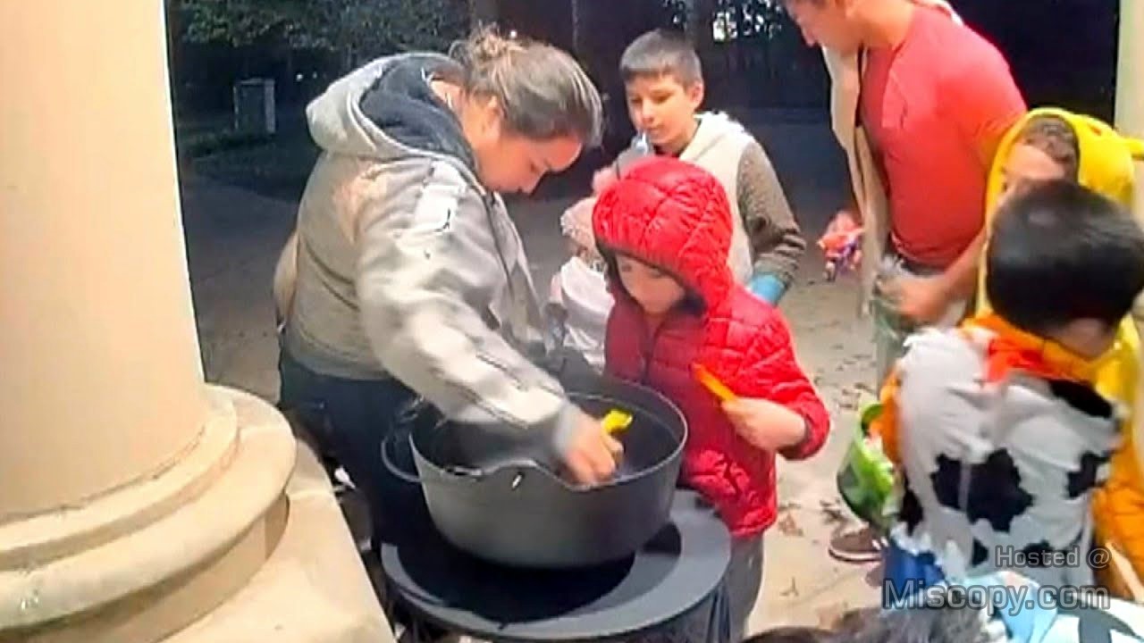 CCTV of Children Accompanied by Mother Raiding Halloween Candy Bowl